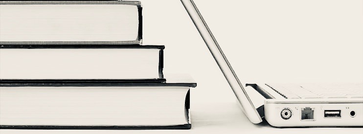 Stacked Books with Laptop